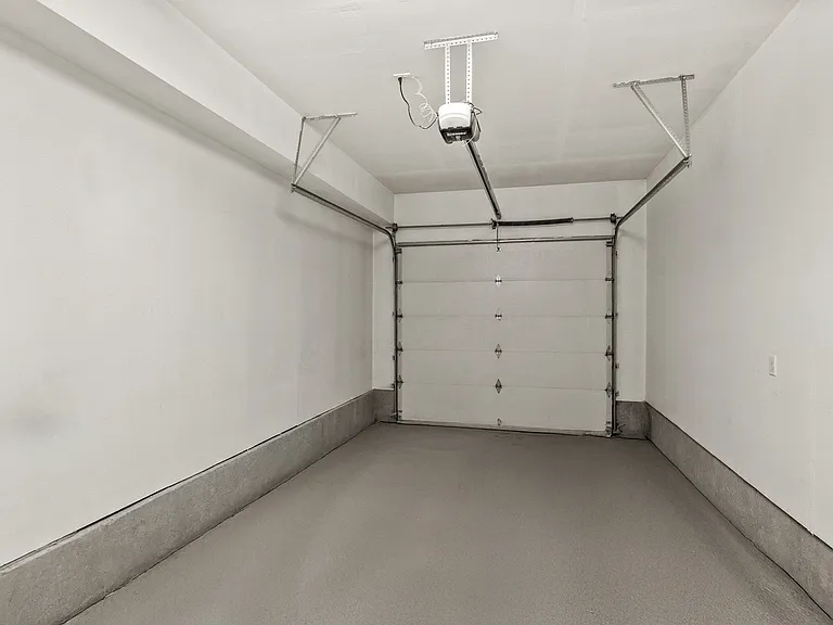 Private single-car garage with an automatic opener and clean, finished interior. Private single-car garage with an automatic opener and clean, finished interior.