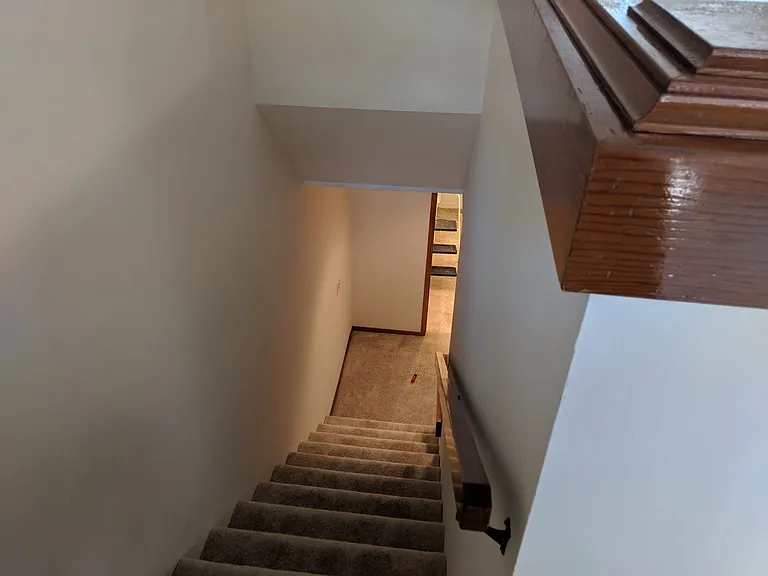 Stairs to bedrooms and bathroom