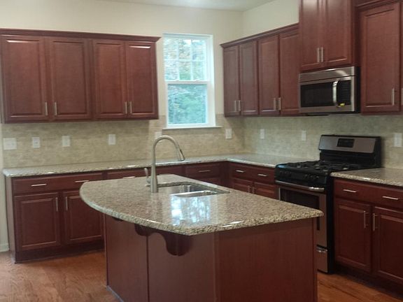 Kitchen with granite countertop & backsplash