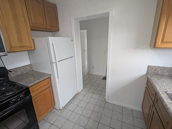 Kitchen with refrigerator