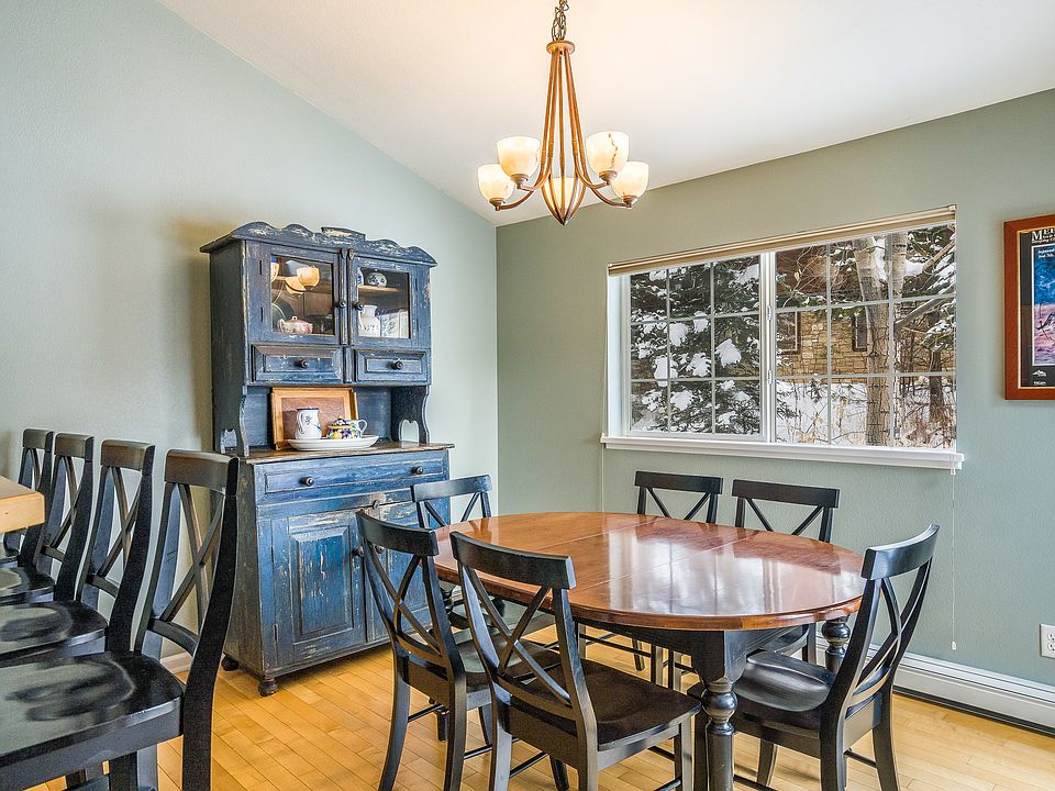 Dining room. Great for family style dinner and big board or card games (which we have plenty of!). The whole upstairs of living room, dining room, and kitchen have a very "together" feel.