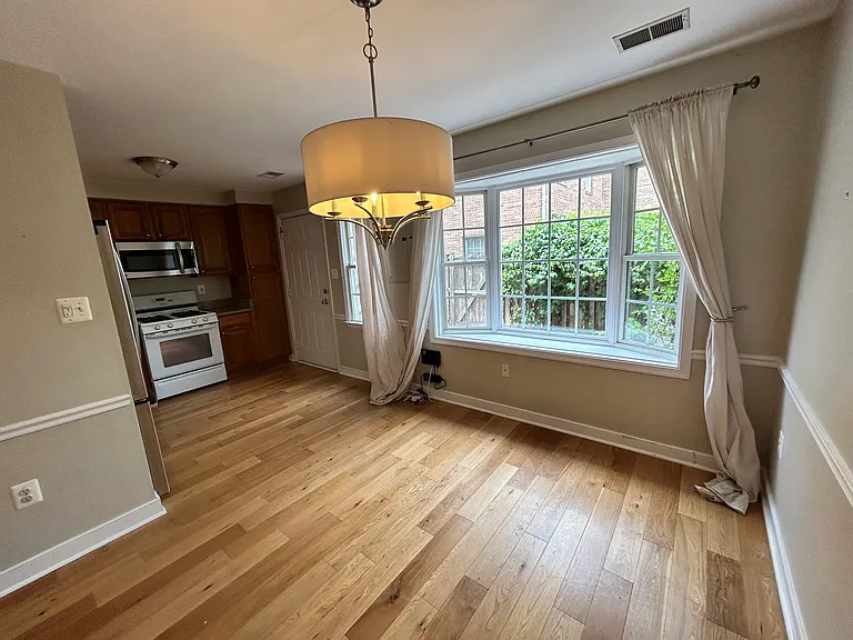 Dining room with bay windows overlooking patio