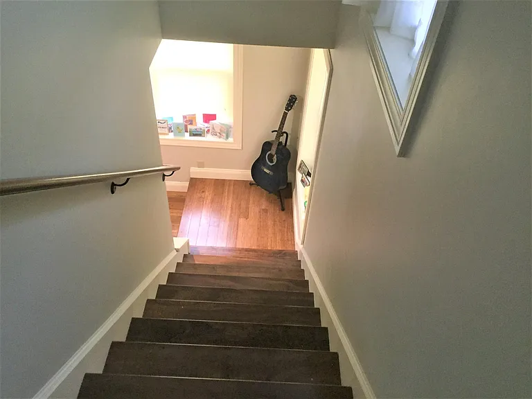 Looking down stairs from 3rd floor bonus room