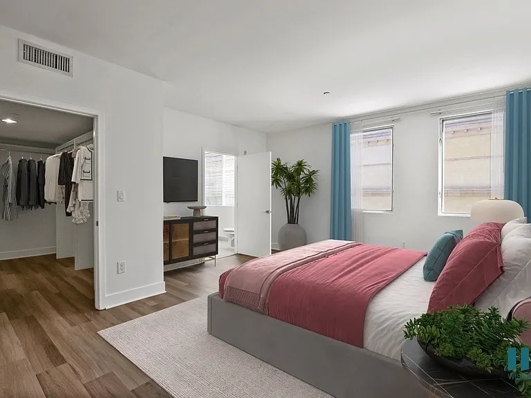 Bedroom with Walk-In Closet, Vinyl Flooring, and Bathroom