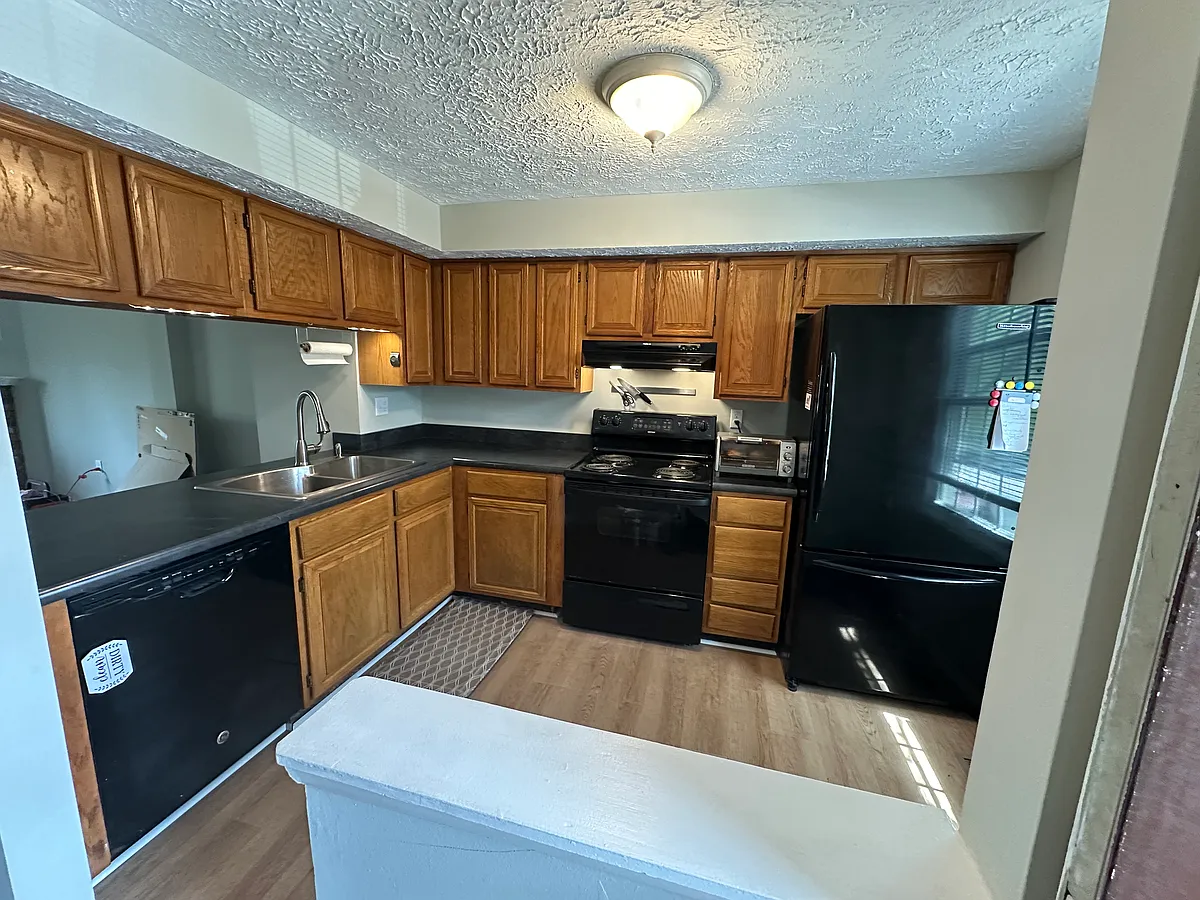 New kitchen countertop makes this kitchen pop! Dishwasher, stove/range and refrigerator with a pull out freezer drawer. New double sink with garbage disposal. - 5811 Rowanberry Dr #5811