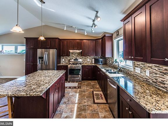 Large kitchen with many upgrades. Granite counter tops, cherry cabinets, large island and stainless appliances.