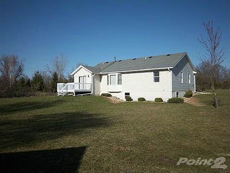 Backyard deck and nice backyard with room to roam.