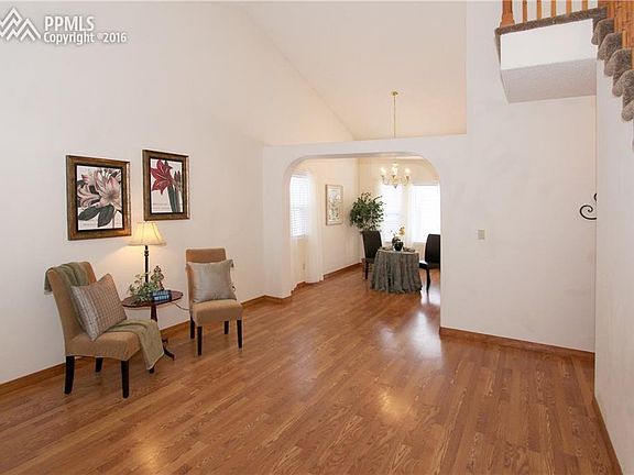 Stunning living room looking into the dining area through arched wall