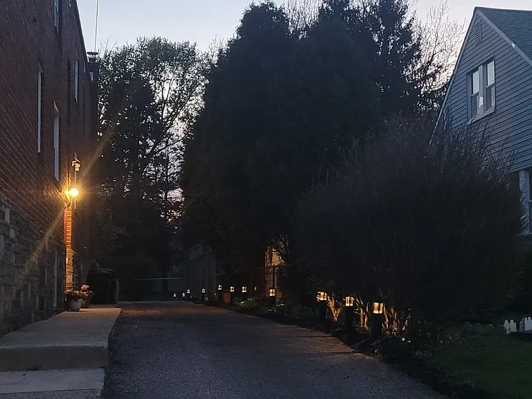 Lighted driveway. Parking in rear of building
