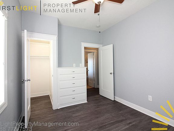Bedroom with closet and built-in dresser