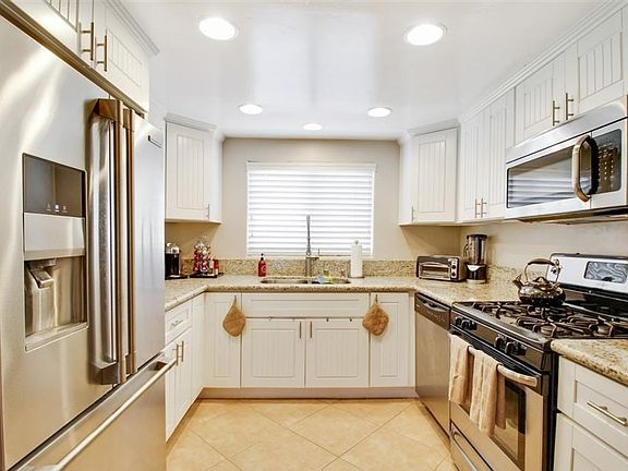 Kitchen with Electrolux Icon refrigerator, dishwasher, stove & microwave