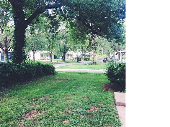 Mature trees and greenery provide shade and privacy