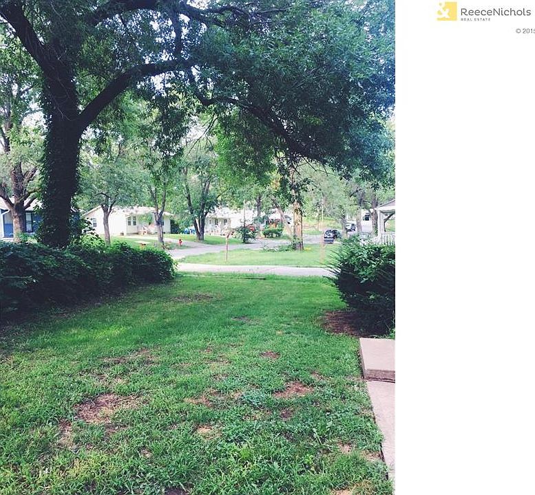 Mature trees and greenery provide shade and privacy