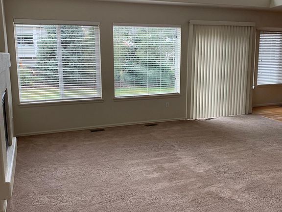 Family Room looking into Backyard trees, grass & Patio