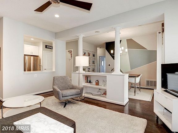 Living Room Opens to Dining and Kitchen