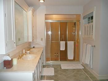 Great master bathroom has double vanities, double rain-showerheads, enormous walk-in closet!