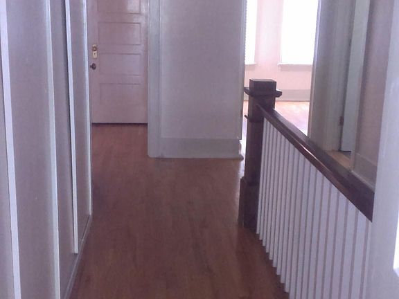 Upsatairs landing with original wood floors 