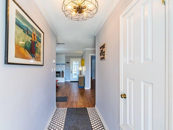 Front door entry-door from garage is seen in this shot