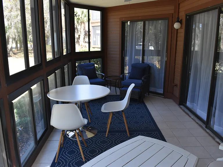 window enclosed Lanai and relaxing furniture