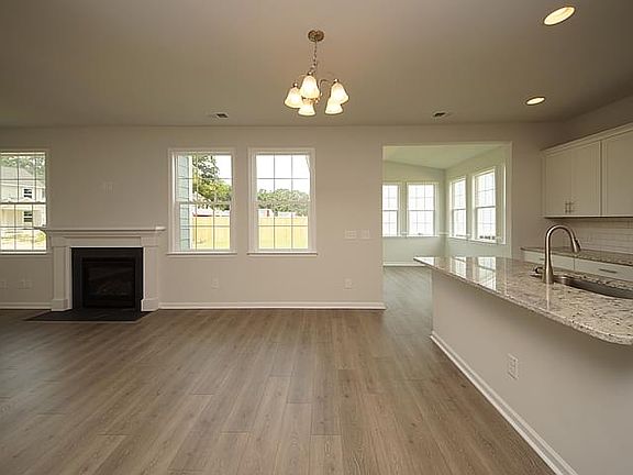 Photos are of a similar home