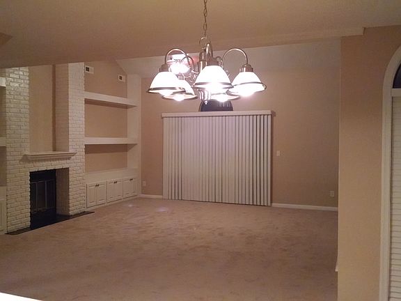 Living Room with access to balcony. Carpet has been replaced with wood flooring