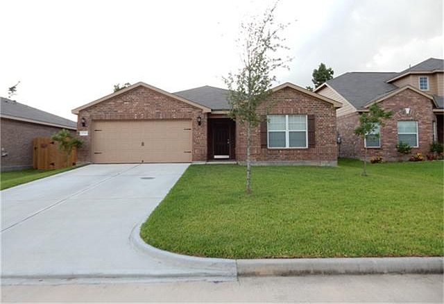 Front of the home with garage entry on the left