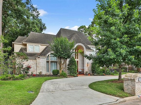 White-washed brick finish home is fresh & contemporary. Entry features large pendant light & flanking sconces w/ mature landscaping.