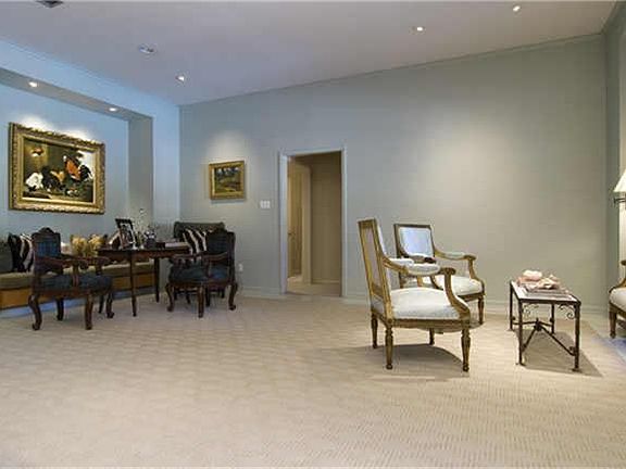 (19x31)A view of the great room shows ample space for several seating arrangements. A built-in banquette, shown at left, provides a charming conversation area within recessed wall space.