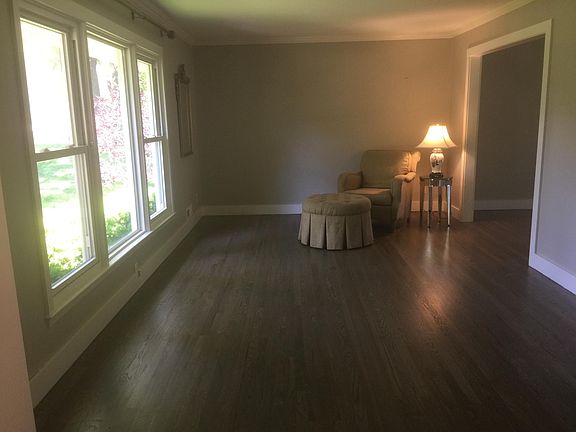 Living room (approx. 19' x 12') features lots of natural light and beautiful hardwood floors. The entrance on the right opens to the formal dining room.