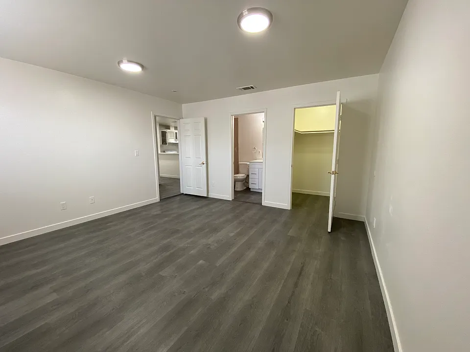 Master bedroom with walk-in closet and bathroom