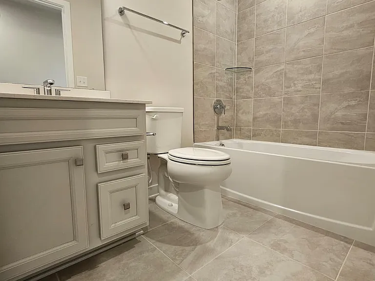 2nd bath with floor to wall tiles