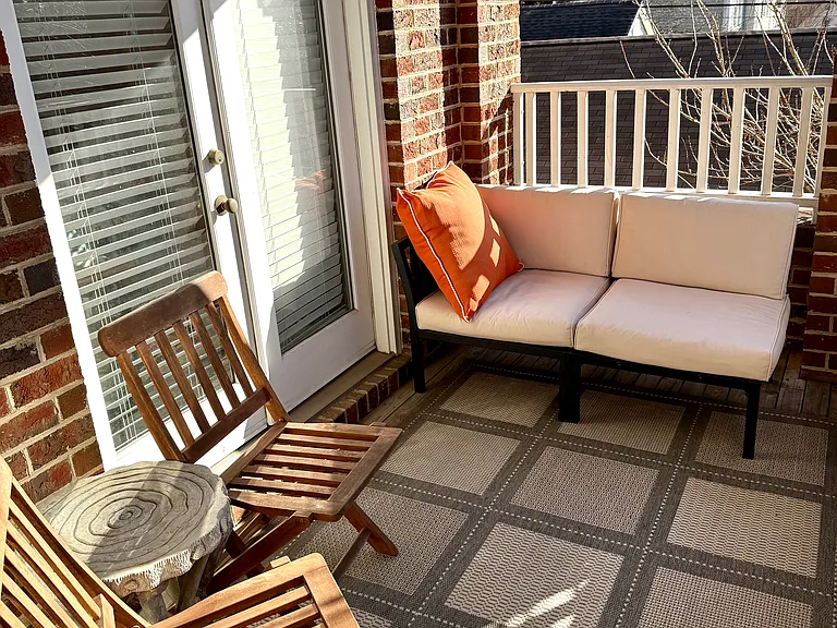 Spacious porch with access to primary bedroom and living room