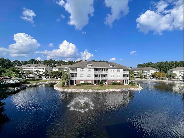 The third-floor balcony overlooks this lovely pond and fountain for a relaxing morning with your coffee or to settle down for the evening with your favorite spirit.