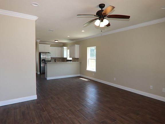Living, dining looking into kitchen
