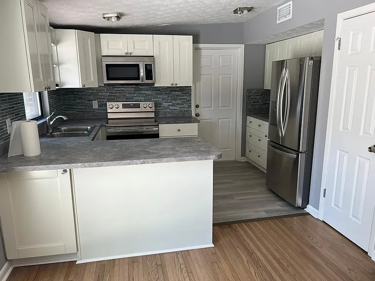 Completely new kitchen and appliances and flooring.
