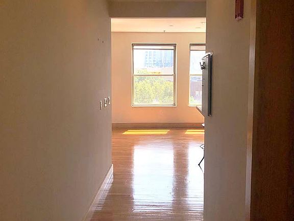 Hall to living room, dining room, and kitchen