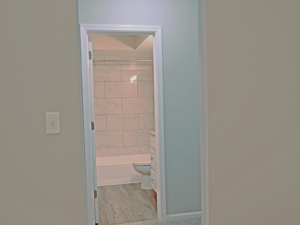 View into Bedroom Closet and Bath
