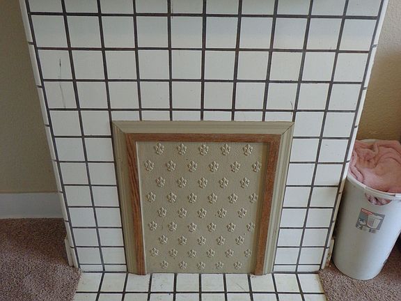 With a decorative fireplace.