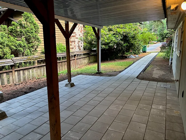 Covered patio and path to the on-street parking.