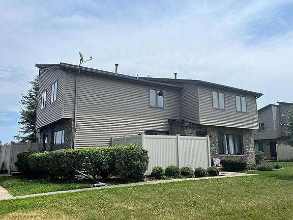 Private patio off kitchen with locking gate