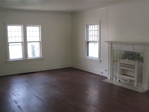 This living space features elegant hardwood floors and ample