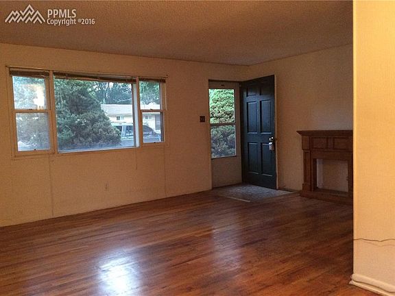 Living room has hardwood floors and large picture window!