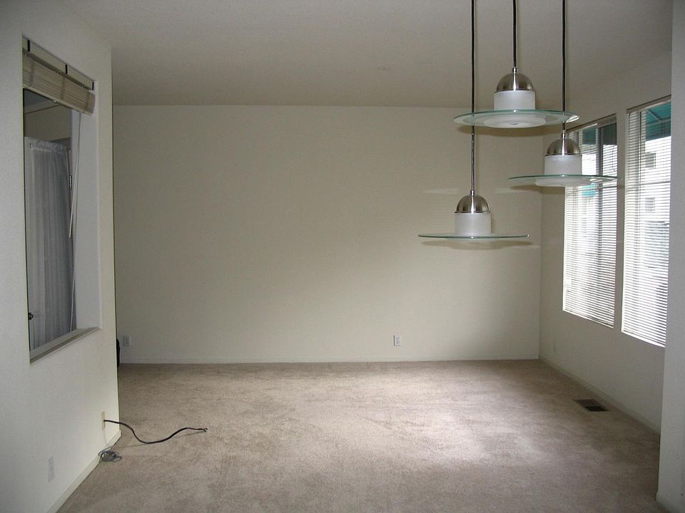 The living area as seen from the kitchen (before carpet replacement).