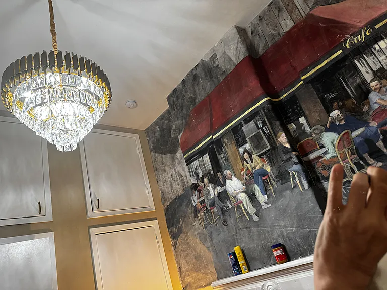 Master bedroom boasts a Parisian street scene mural.