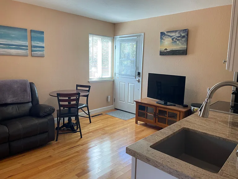 Reclining loveseat, cafe table and chairs. TV and TV stand.