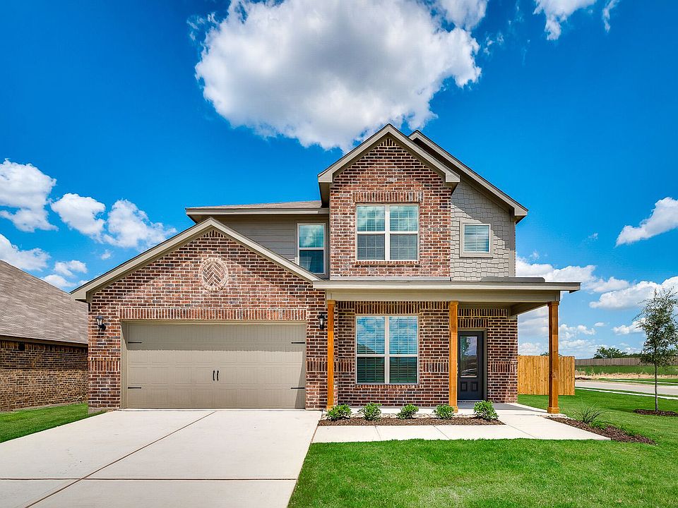 The Superior is stunning with a spacious front porch and gorgeous brick exterior.