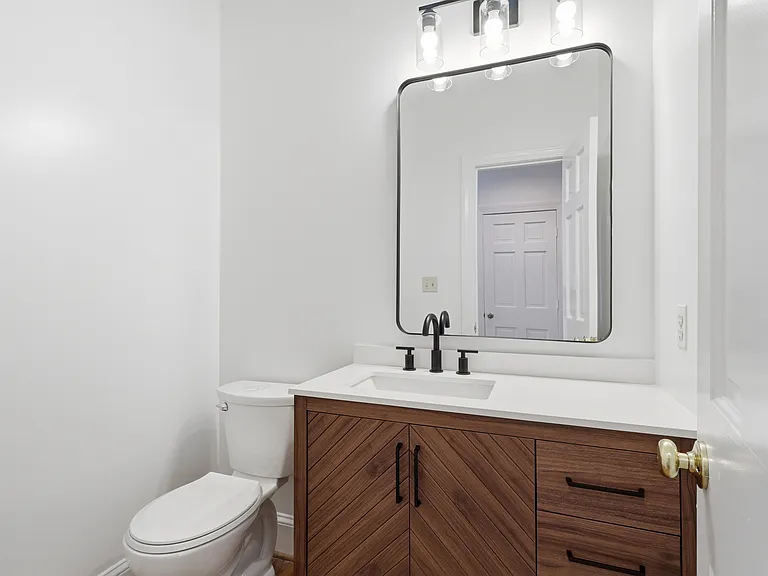 Main level bath with new vanity and toilet.