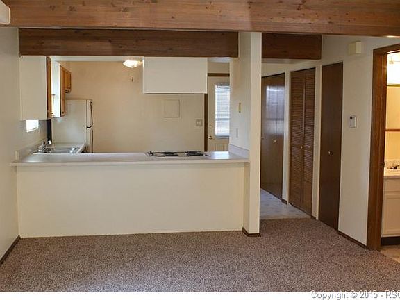 Kitchen view from Living area. 1/2 bath to the right.