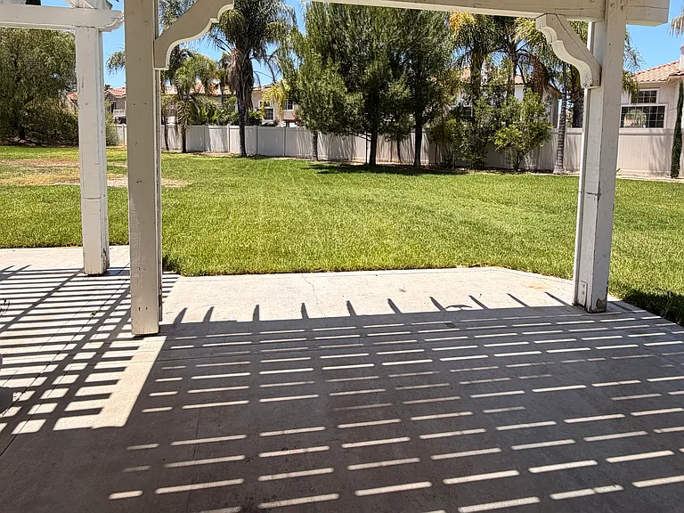 Large backyard with covered patio. Brand new pergola is being installed this June.