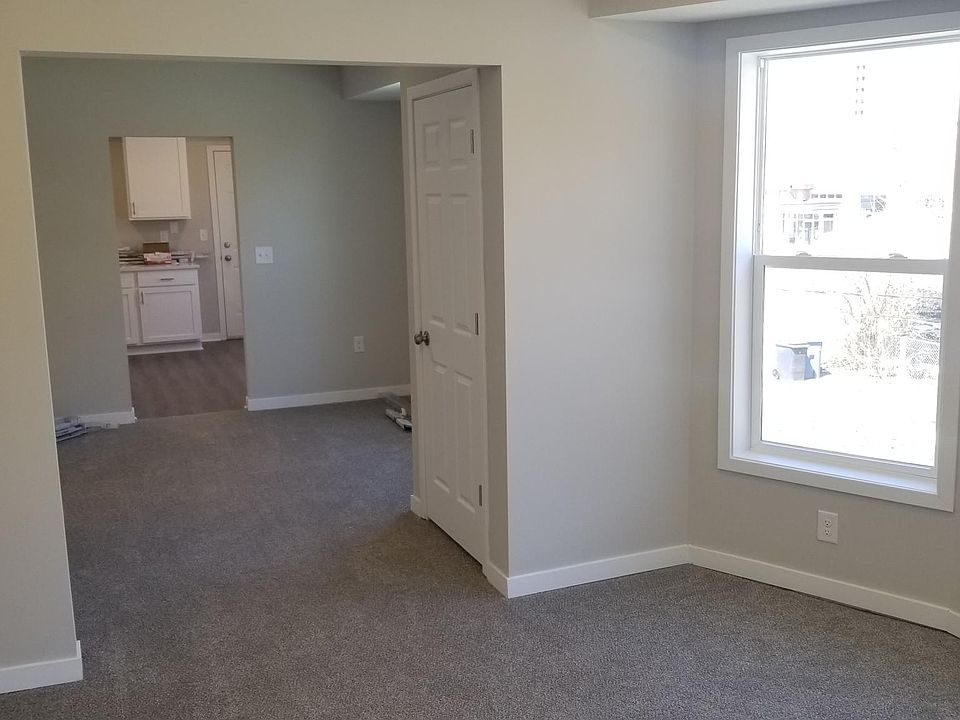 Looking left from the Living Room, through the Dining Room and into the Kitchen